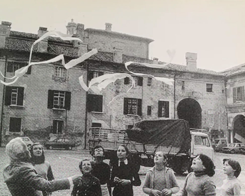 paper streamers above a group of happy people